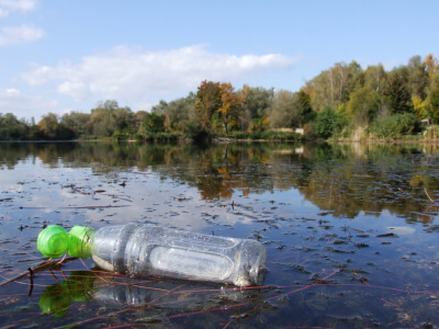 water bottle floating in lake
